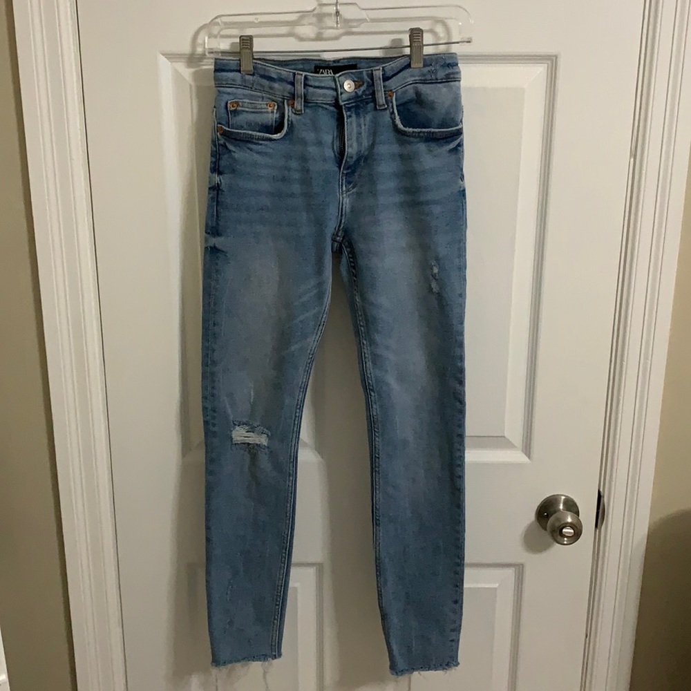Zara blue skinny jeans with frayed hem and rip